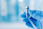 doctor holding syringe-GettyImages-1446843578