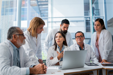 GettyImages-2183476270-doctors-meeting-computer-office-table GettyImages-2183476270-doctors-meeting-computer-office-table