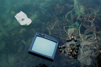 How To Keep E-Waste Out Of The Water Cycle old television abandoned in water-GettyImages-1256915477