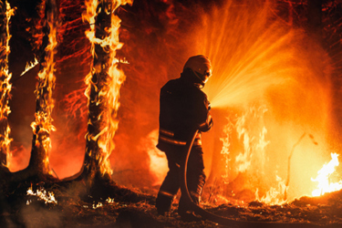 Firefighter extinguishing fire-GettyImages-1482175402