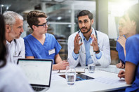 Rethinking Lab Logistics: Delivering The Complex Without Compromise GettyImages-638646884 medical team meeting