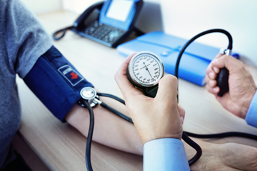Doctor-checking-patient-blood-pressure-GettyImages-873891794