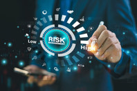 Controlling Risks In Medical Writing Reviews GettyImages-2150532636-risk-management-dial-high-low-pen-man-standing