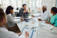 Accelerate Path To Clinic With CMC Consultation Services GettyImages-2024666721-meeting-table-office-business-man-doctors