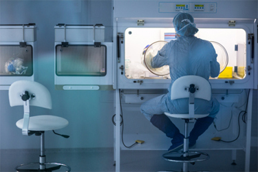 GettyImages-1472832232-pharmaceutical-equipment-isolator-scientist-sterile