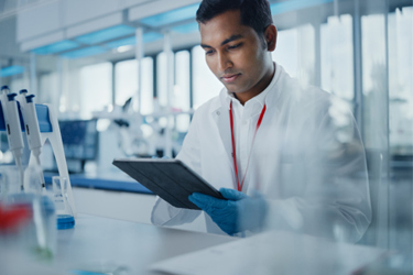 Scientist Using Tablet In Lab GettyImages-1354172577