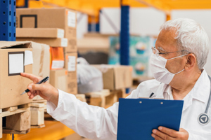 Doctor checking medical stock warehouse-GettyImages-1249564491