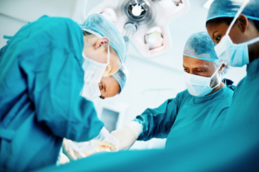 Medical team performing surgery-GettyImages-155153177