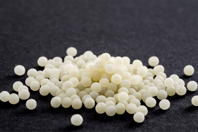 GettyImages-1366988638-beads-gray-background