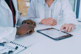GettyImages-1288871608-doctors-tablet-sofware-office-setting