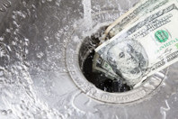 Money down drain-GettyImages-171578755