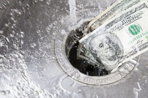 Money down drain-GettyImages-171578755