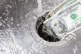 Money down drain-GettyImages-171578755
