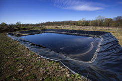 Insulated leachate pond with dirty water, part of landfill-GettyImages-1390782041