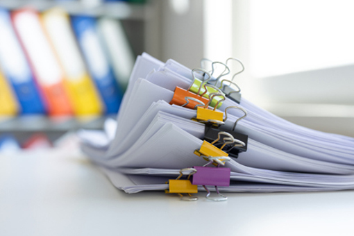 stack of clipped documents-GettyImages-2213243327