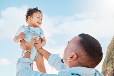Father playing with child-GettyImages-1567083882