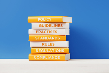 Books of compliance and regulations-GettyImages-1174513035 Books of compliance and regulations-GettyImages-1174513035