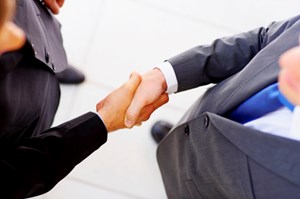 What Does Consolidation Really Mean To The Channel? hand shake 450x300