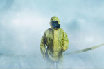 Worker in protective suit-GettyImages-1175860683