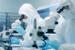 GettyImages-899692950-cleanroom-microscopes-scientists-analyze