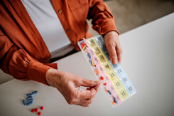 Senior woman taking medicine-GettyImages-1310657903