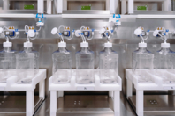Why Manual Bottle Filling Puts Biomanufacturers At Risk SUS - Image_biomanufacturer-at-risk-450x300