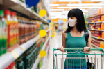 COVID Woman Pushing Cart Wearing Mask