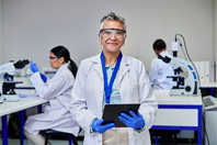 GettyImages-2205869783-scientist-tablet-lab-data-digital