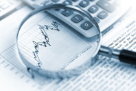 GettyImages-1470034194-magnifying-glass-charts-calculator