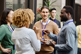 Business professionals chatting at conference-GettyImages-1385328437