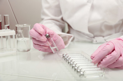 doctor holding vial of medicine-GettyImages-1287223643