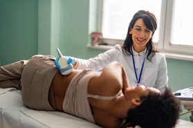 Medical examination of woman using ultrasound equipment of liver kidneys-GettyImages-1482783655