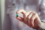 Person Holding Capsule GettyImages-1095605274