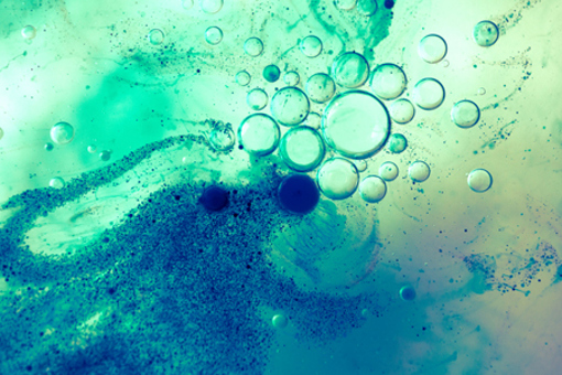 Oil, water, and blue pigment particles-GettyImages-1153909630